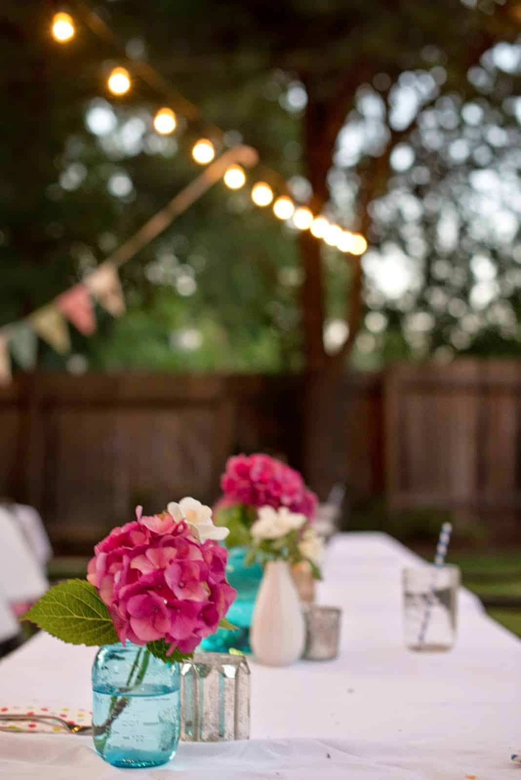 Alt tag for Pink+Backyard+Birthday+Party+domestic+fashionista+cococozy+pink+hydrangea+table+settings+lights