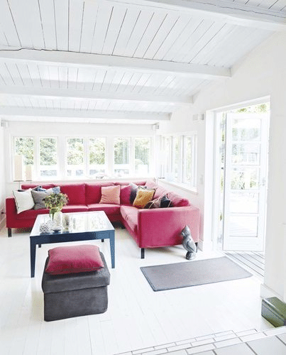 Alt tag for danish+cottage+living+room+pink+sectional+sofa+white+walls+cococozy