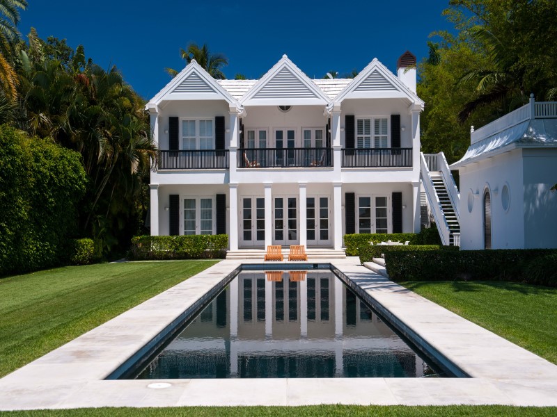 Alt tag for rear-exterior-backyard-pool-white-modern-palm-beach-home-cococozy