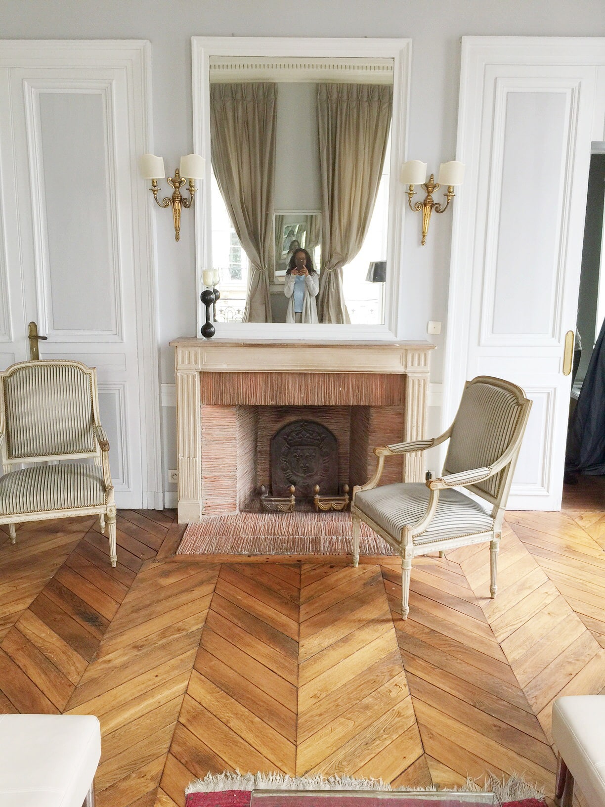 paris-apartment-fireplace-mantel-herringbone-floors-cococozy