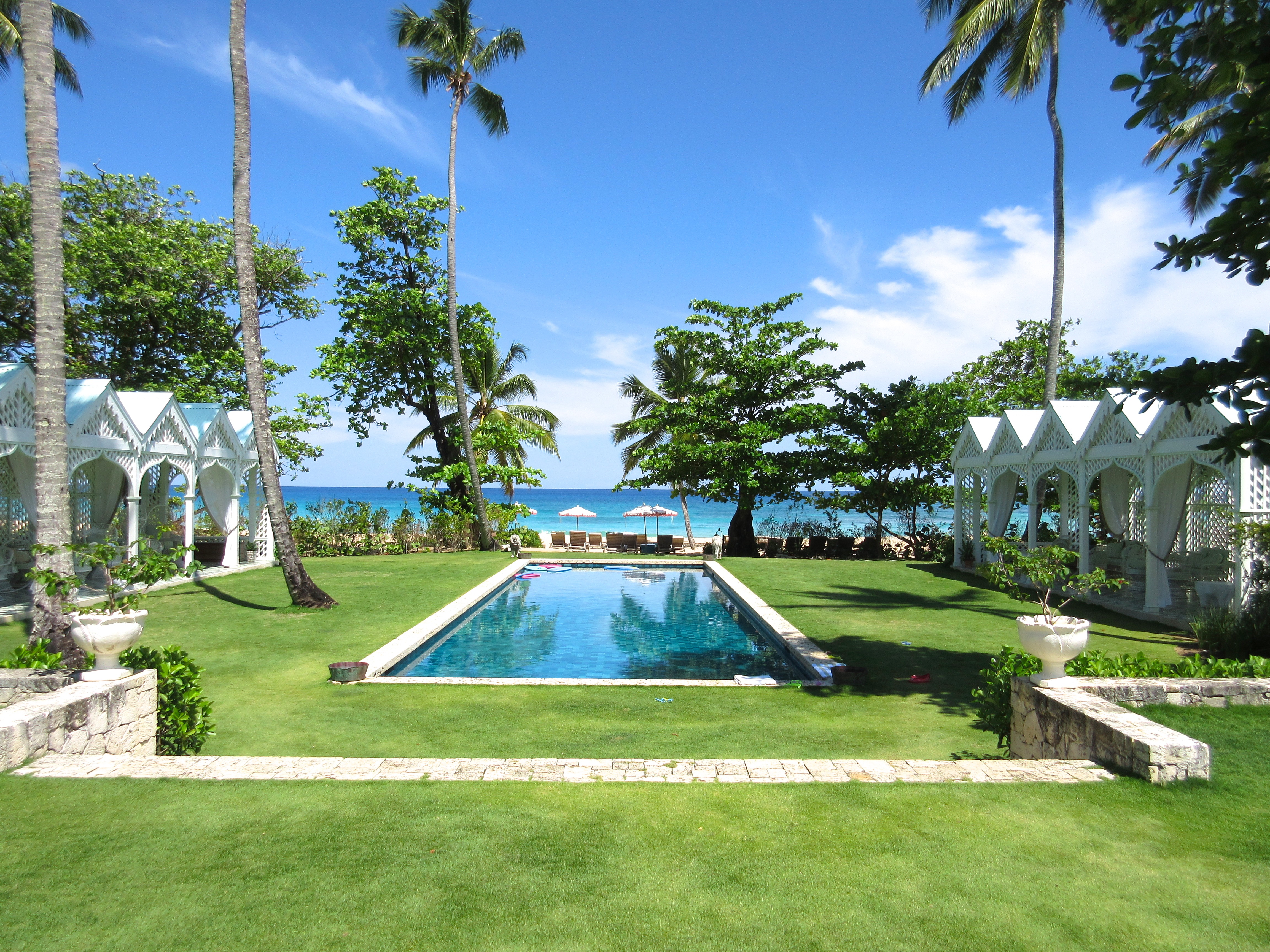 pool-grass-surround-ocean-view-dominican-republic-playa-grande-beach-club-cococozy