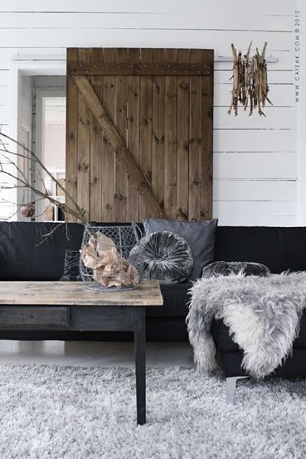 rustic barn door grey cement floor cococozy living room