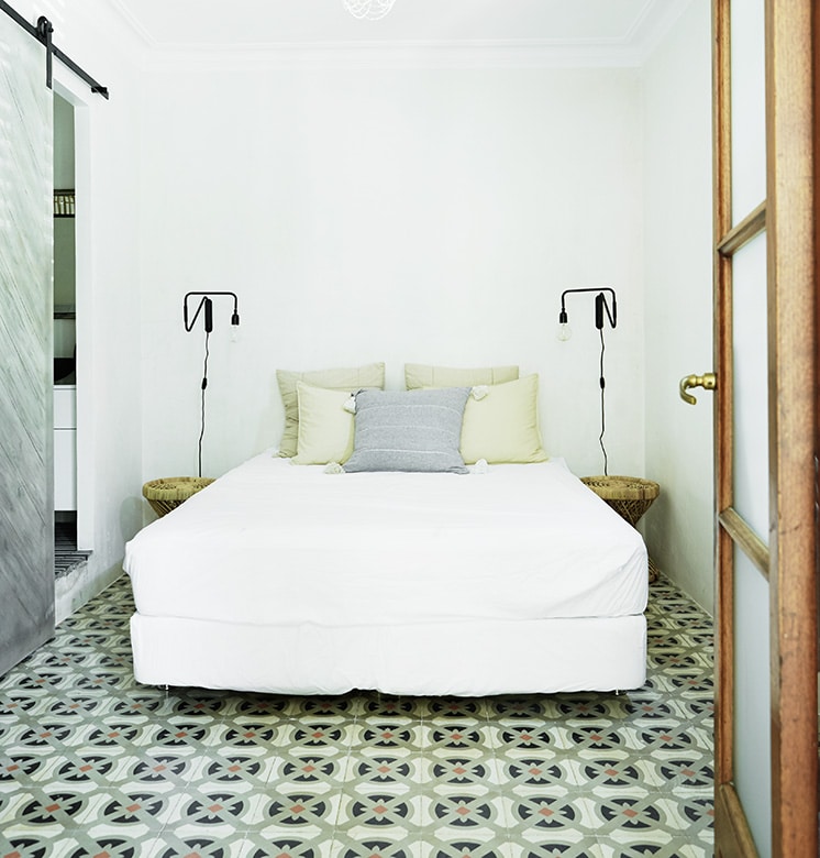 wall to wall cement tile floor guest bedroom