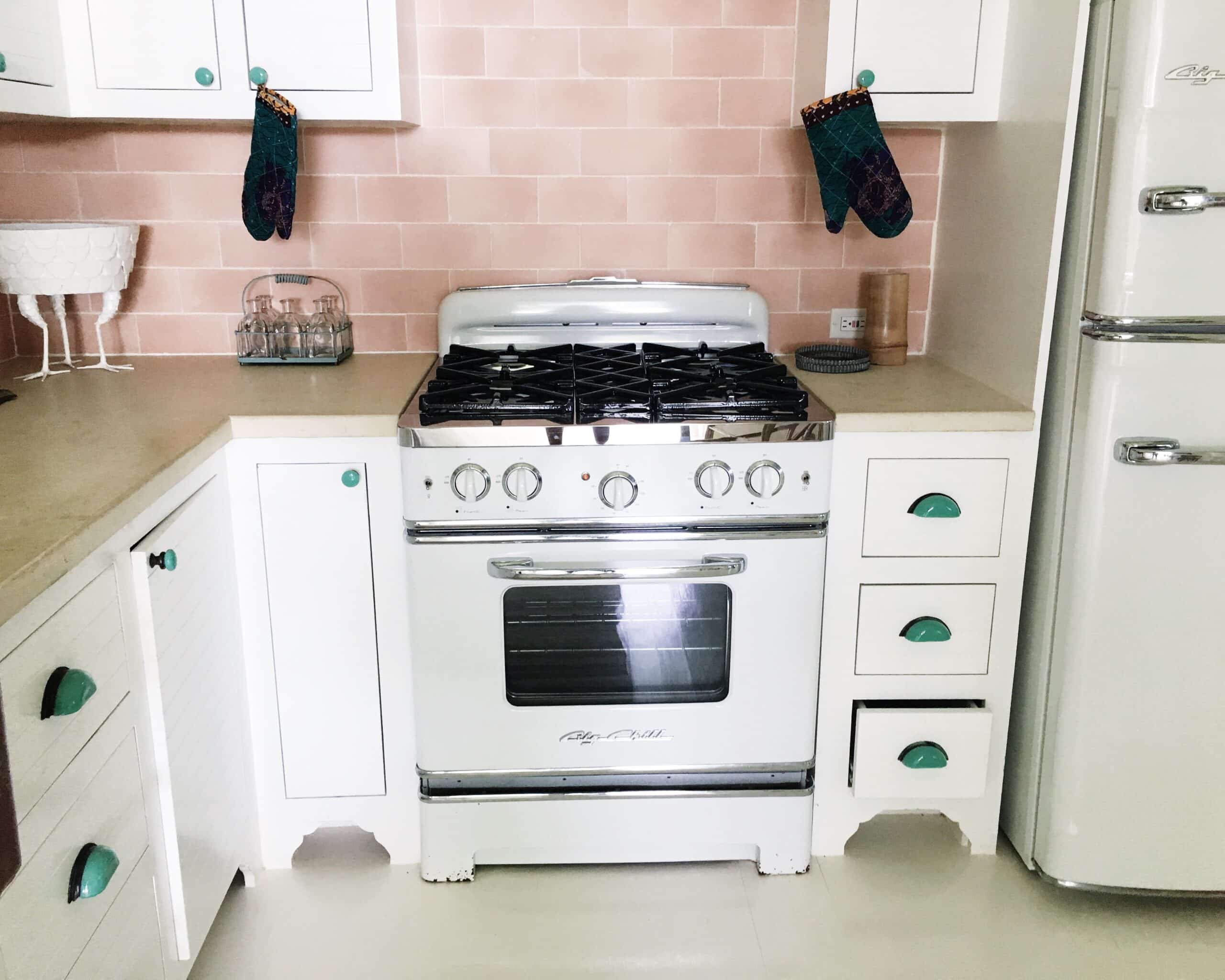 retro kitchen pink tile backsplash white stove big chill range