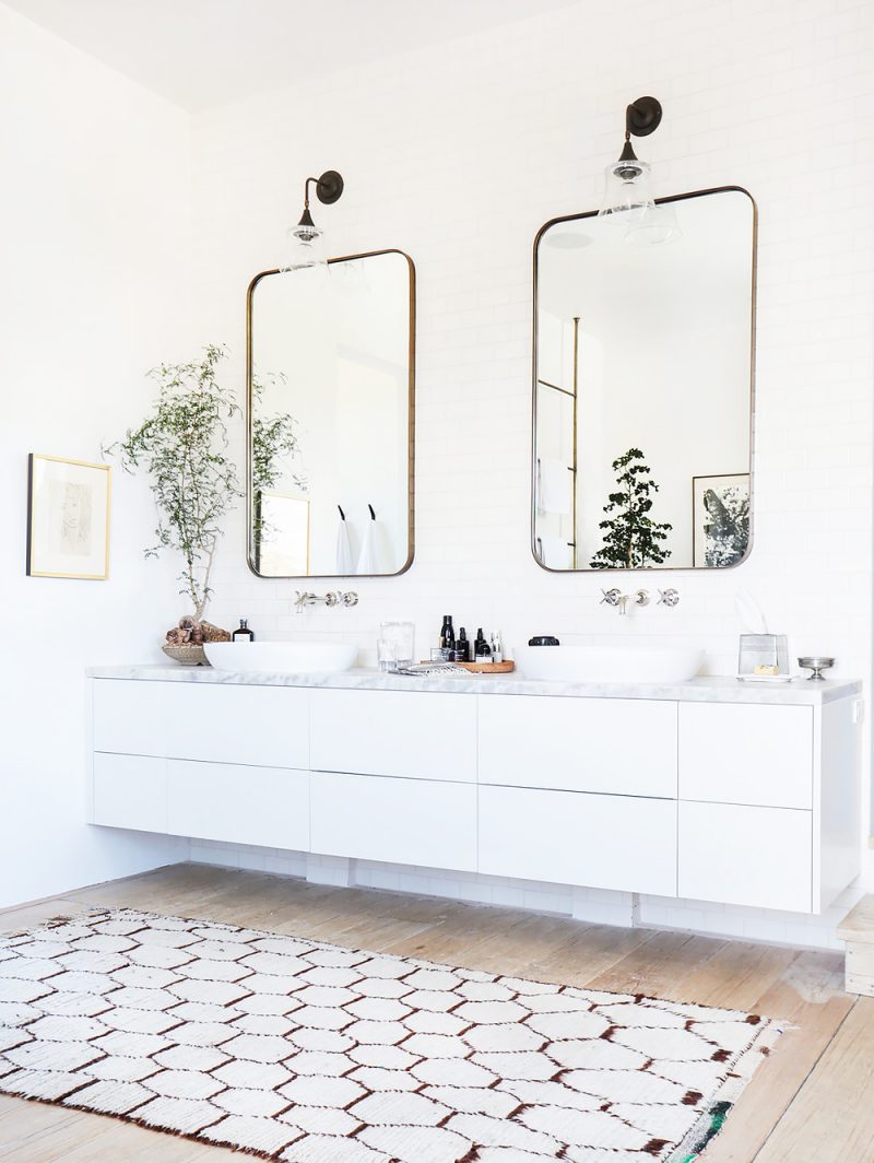 bright white bathroom geometric rug wall mirrors