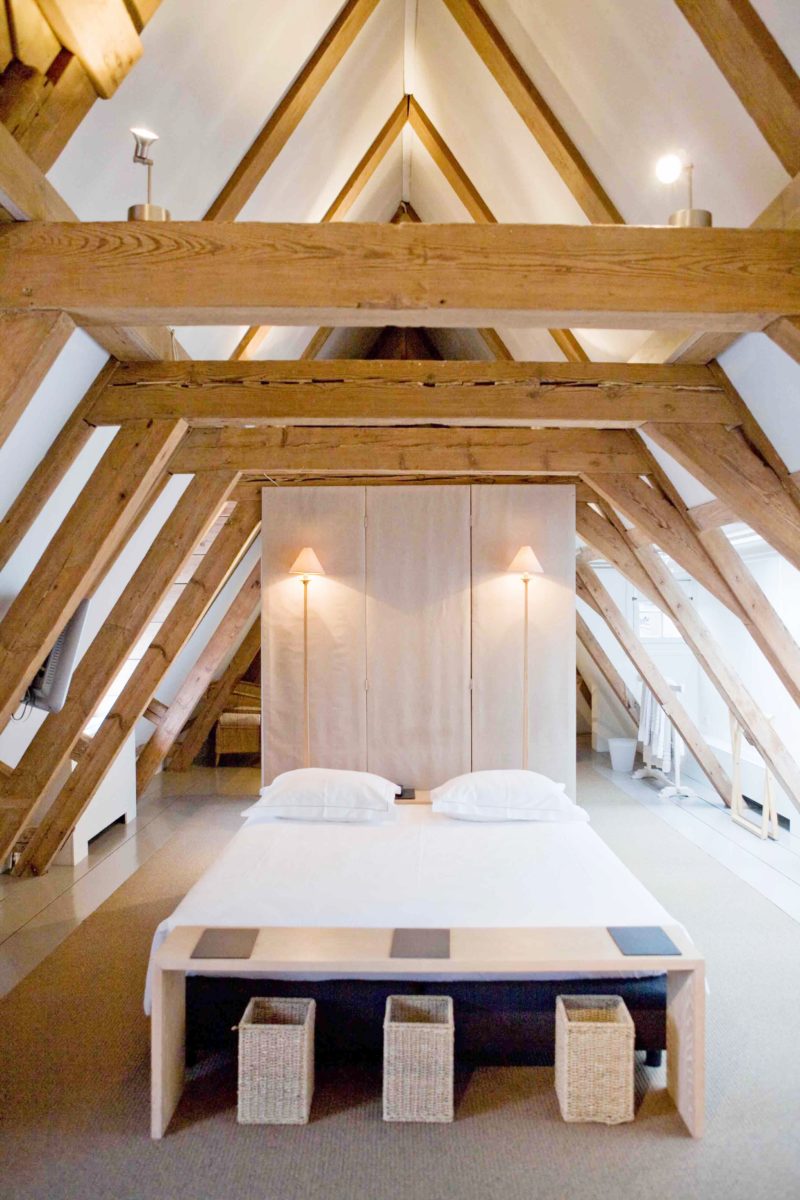Exposed Beam bedrooms Aframe ceiling bedroom bright white bedding