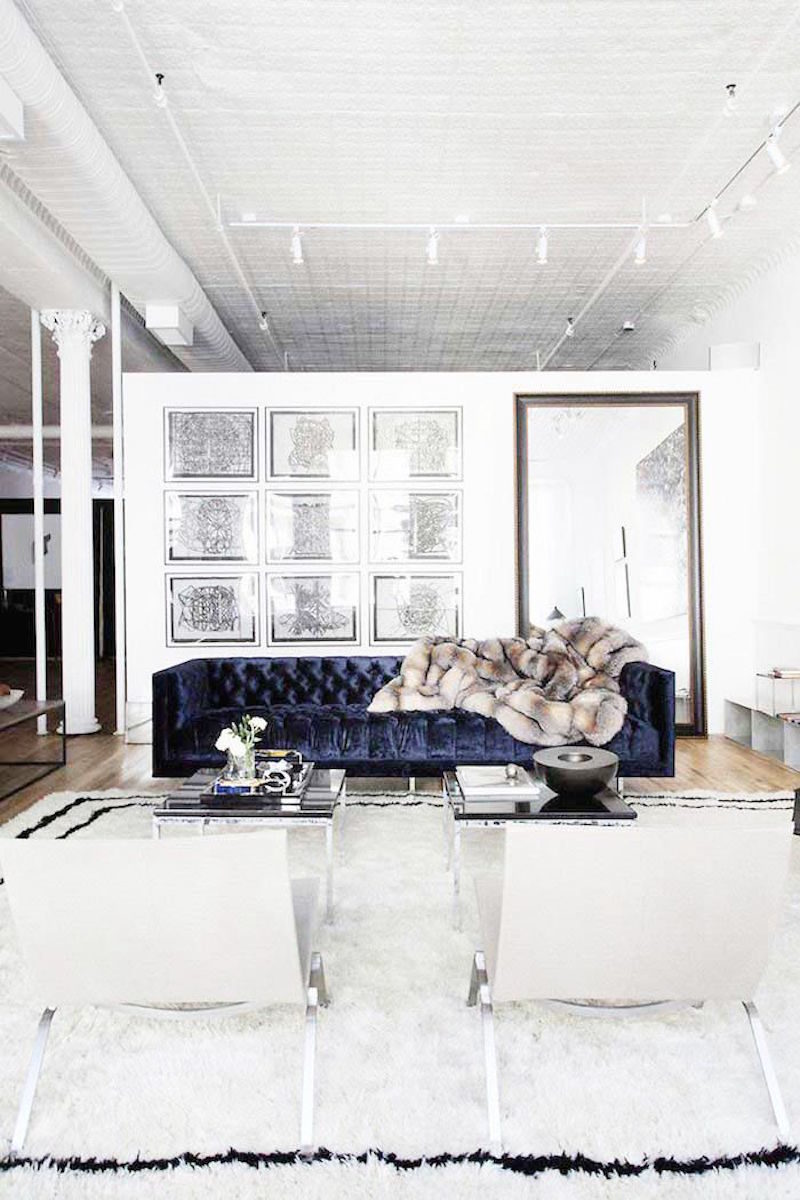 lovely loft navy velvet sofa bright white walls