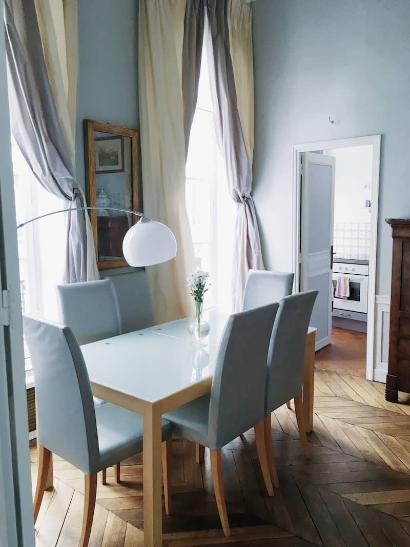 Paris dining room chevron floors table chairs lamp drapery