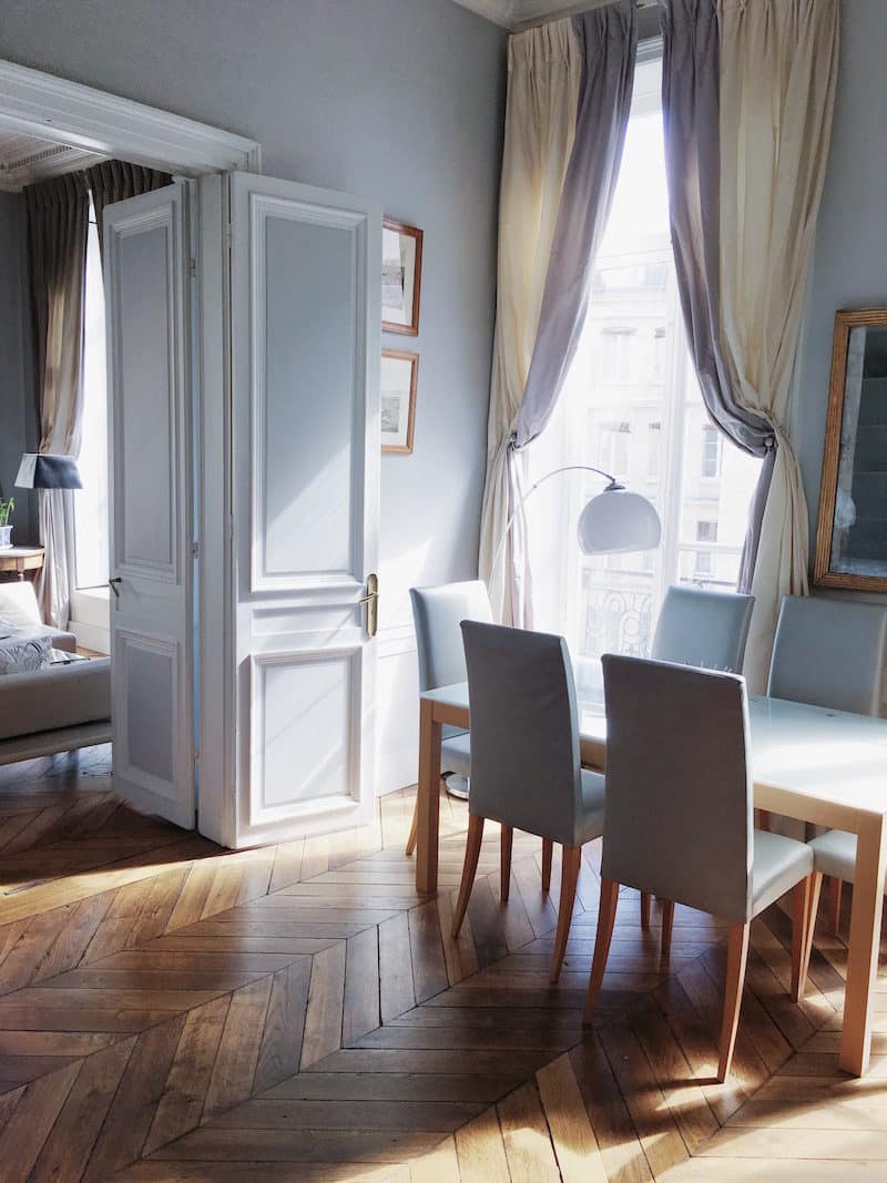 paris dining room drapery chevron floors table chairs white grey walls