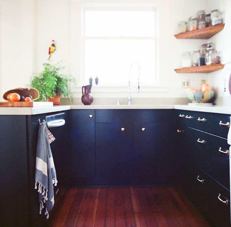 u shape kitchen navy cabinets wood floors
