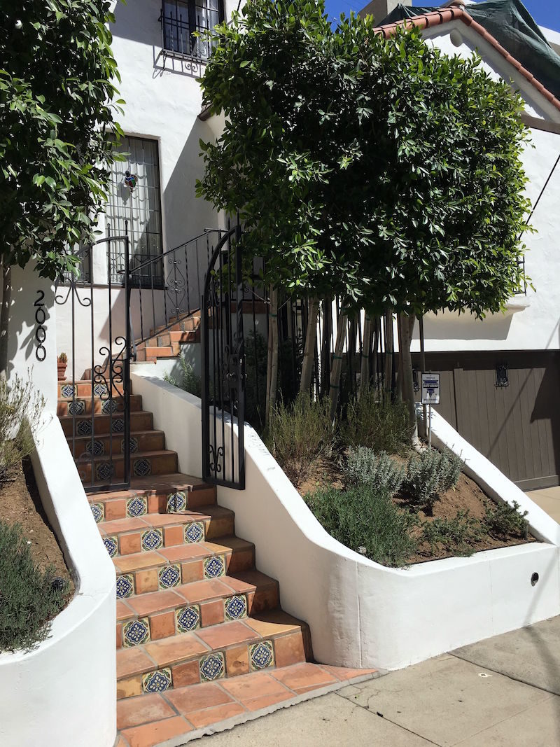 hollywood hills house tour debra messing exterior tile stairs