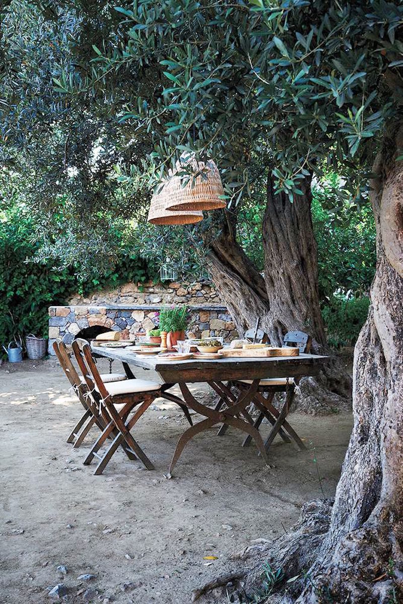 rustic greek villa outdoor dining table chairs pendant lantern