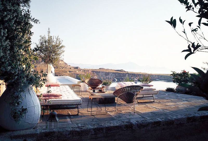 rustic greek villa outdoor views white sofa chairs oceawn