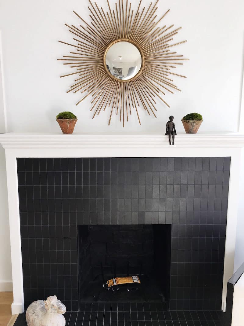venice cottage fireplace sunburst gold mirror black tile fireplace