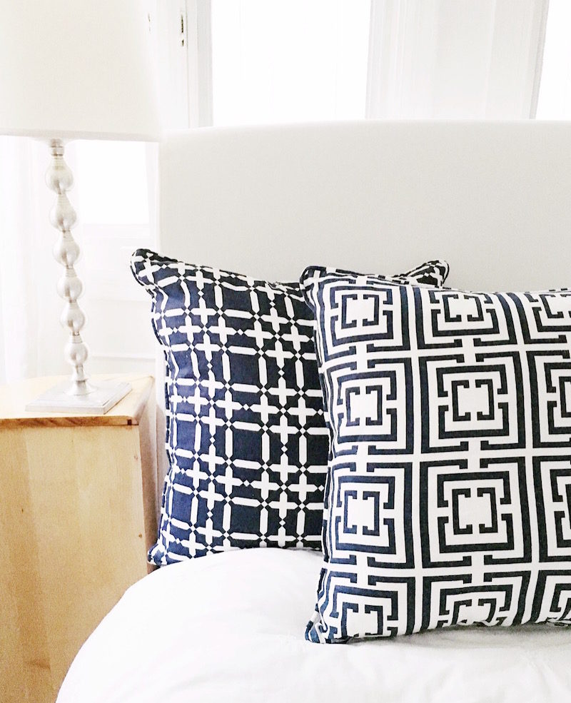 bedside table style navy logo plaid pillows
