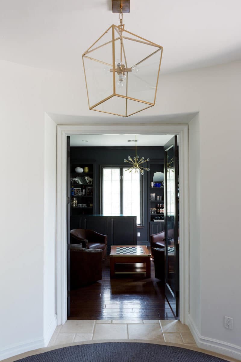 california home remodel library after gold light fixture dark grey walls