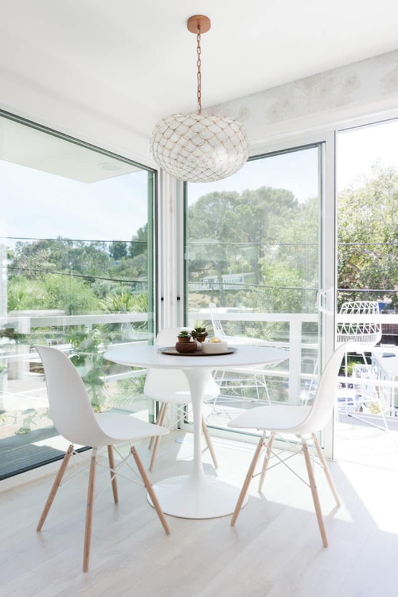 small white kitchen nook windows eames chair
