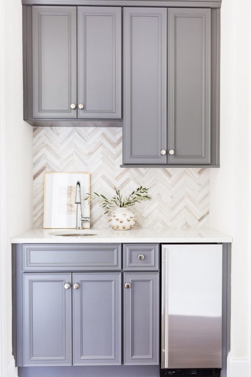 classic white kitchen herringbone backsplash grey cabinets