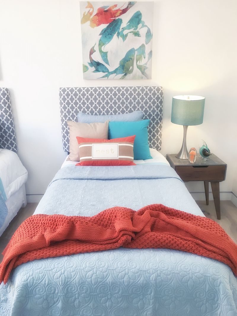 two-twin-bedrooms-blue-red-blanket-rug