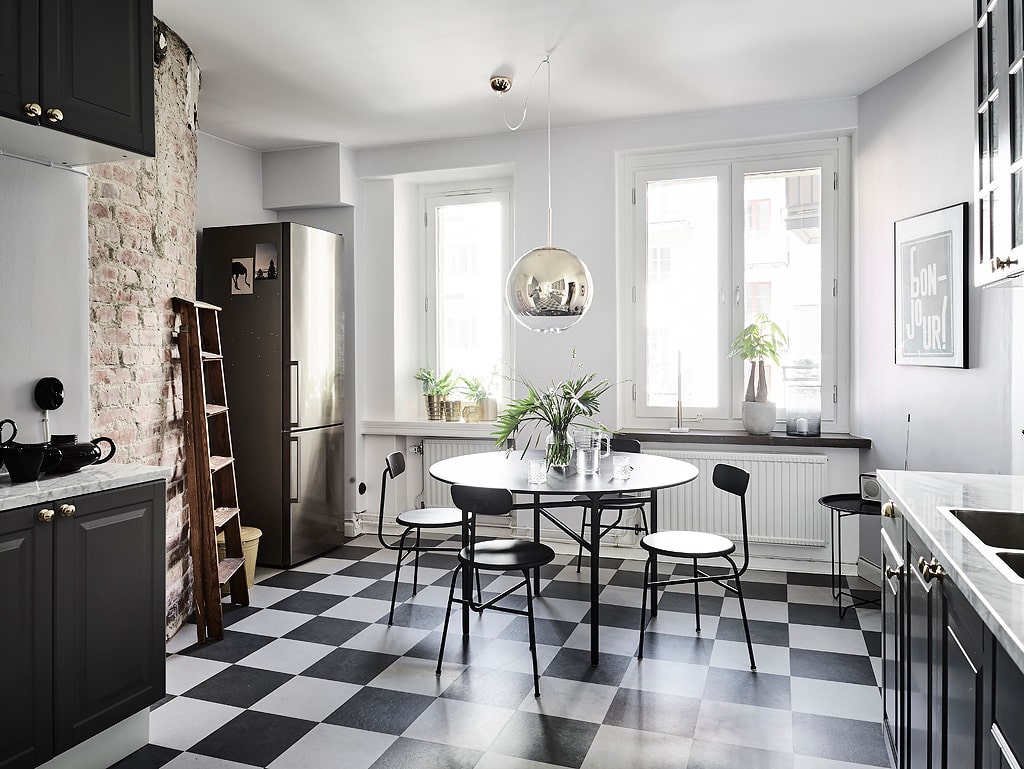 Alt tag for small-eat-in-kitchen-design-checkered-floor-breakfast-nook-dining-table-grey-cabinets-exposed-brick-galley-cococozy-entrance
