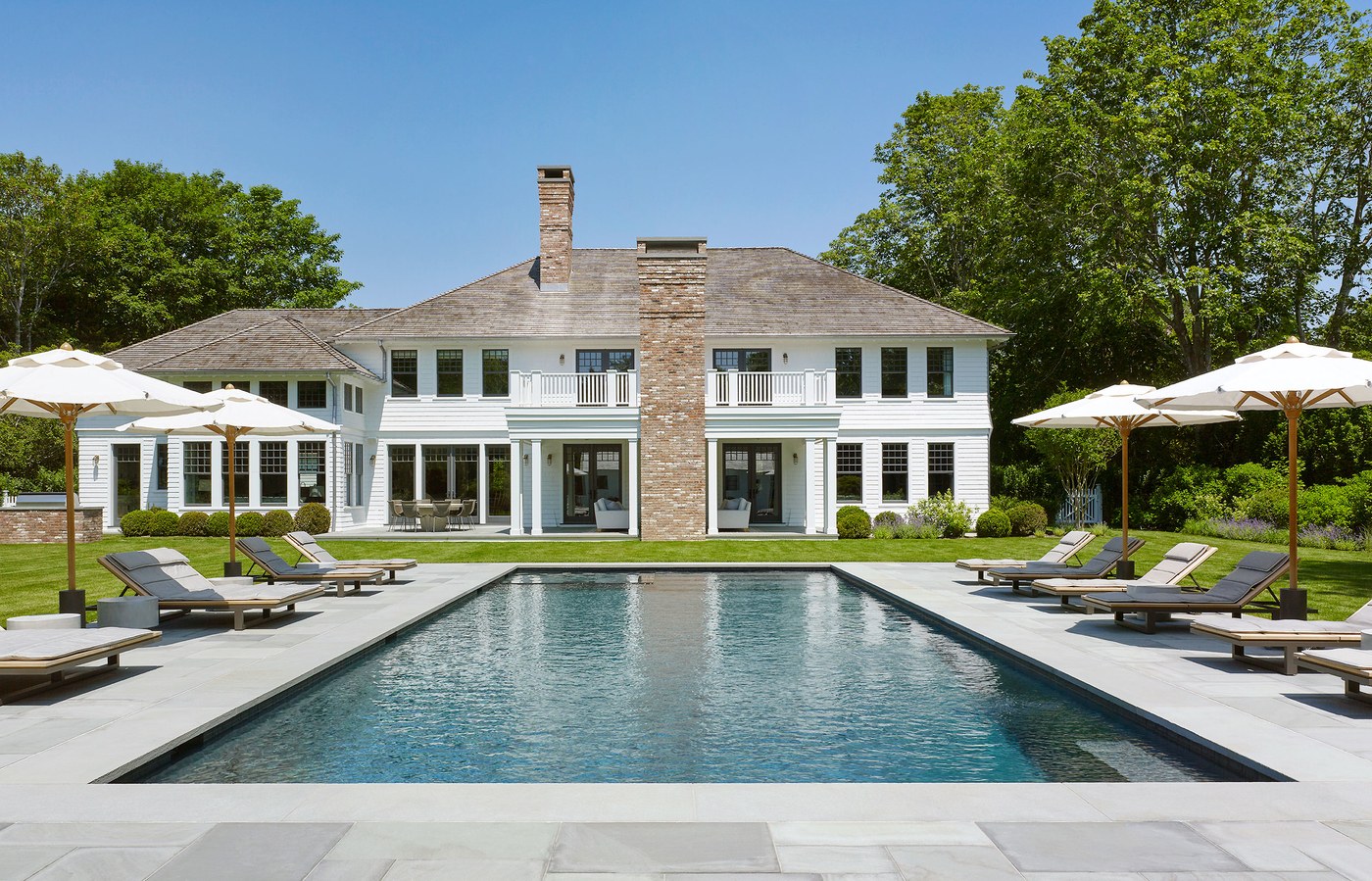 Alt tag for Hamptons-home-modern-twist-pool-backyard-cococozy-architecturaldigest