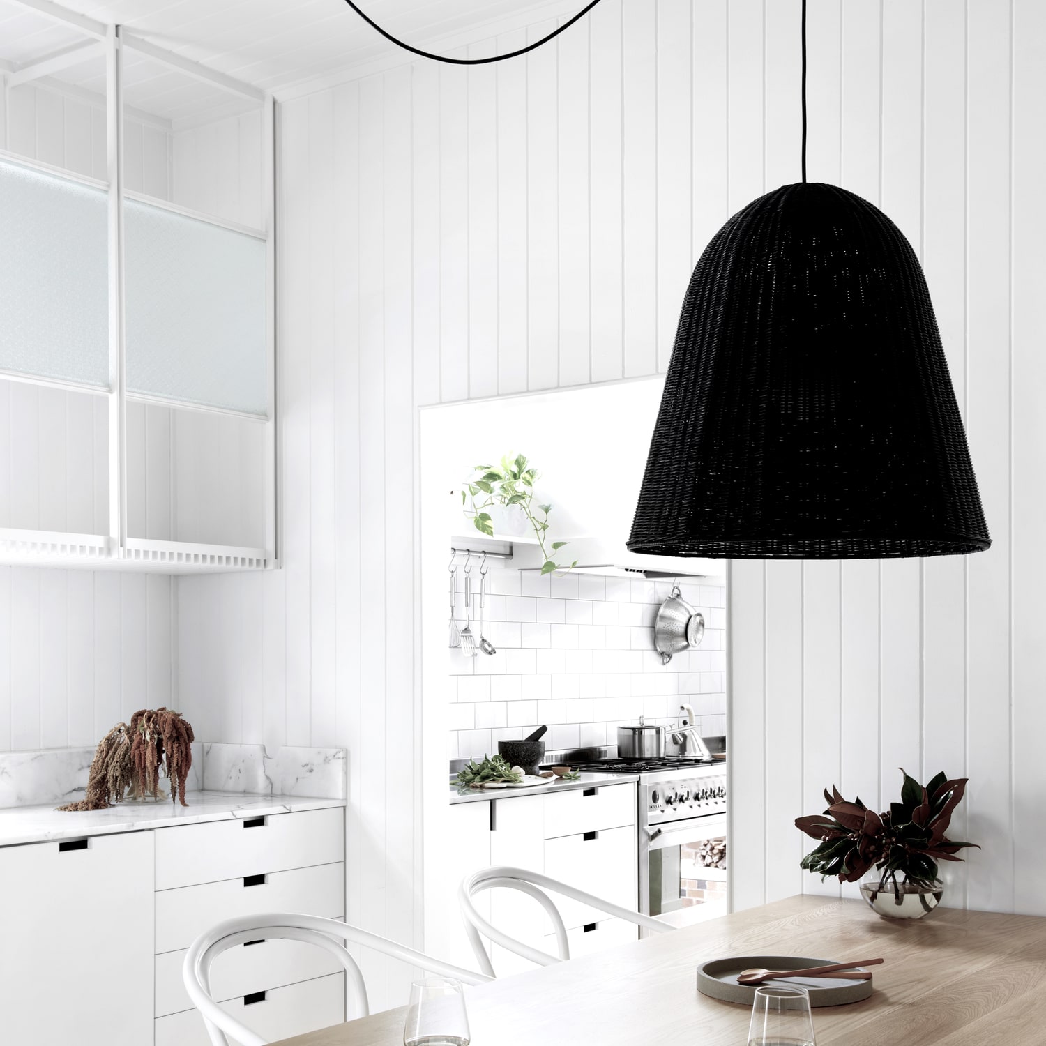 Alt tag for black-white-cottage-dining-room-wicker-pendant-light-cococozy-durhamhouse
