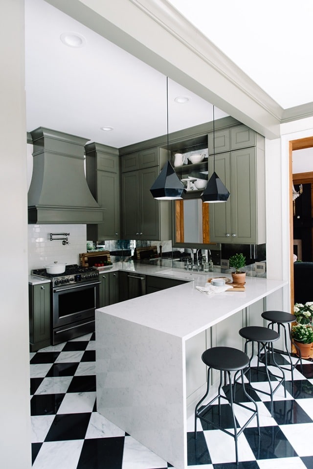 Alt tag for green-small-kitchen-black-white-harlequin-marble-floor-waterfall-quartz-counter-cococozy-themakerista