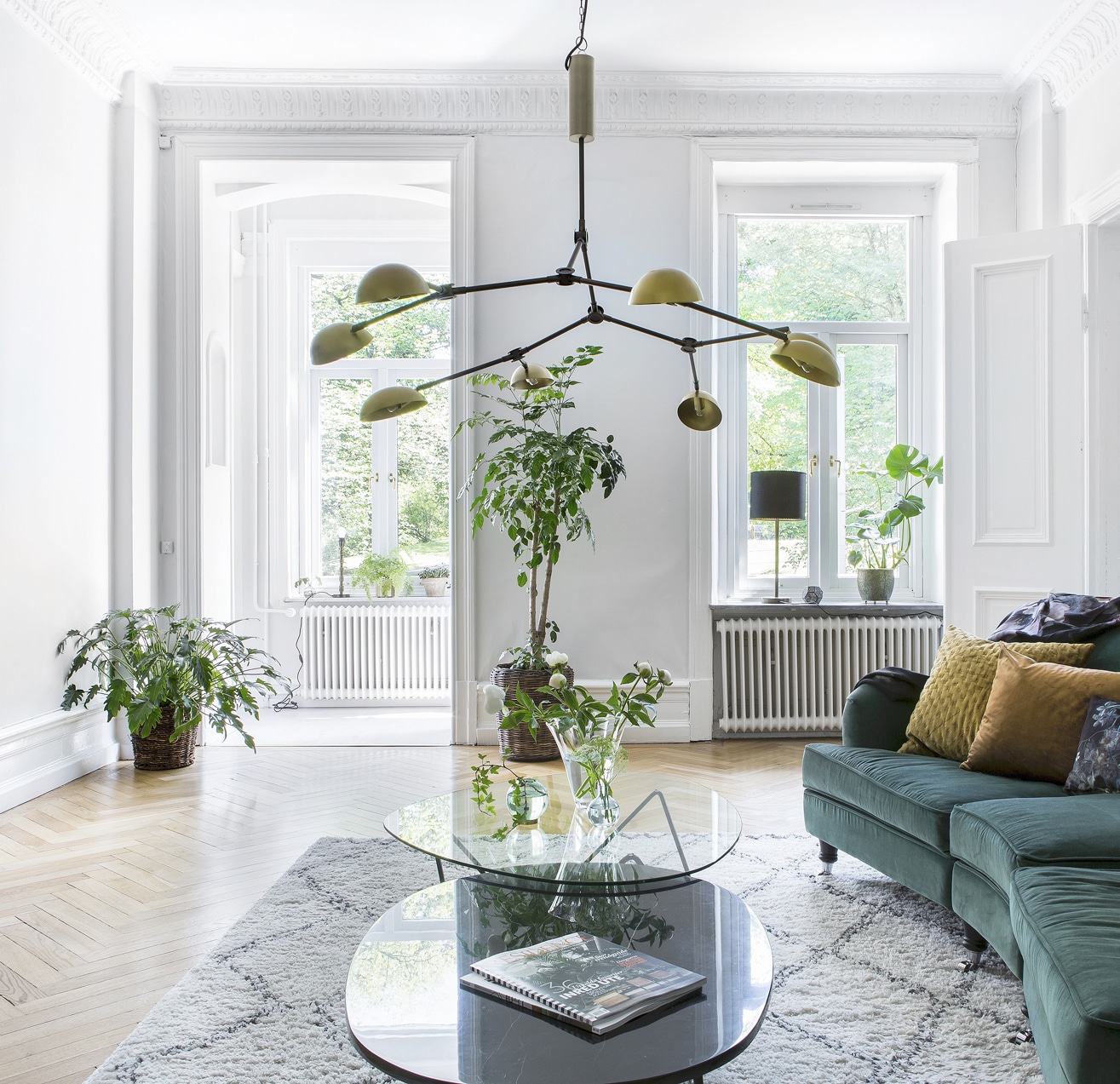 Alt tag for living-room-green-velvet-sofa-couch-herringbone-wood-floor-indoor-plants-2-cococozy-alvhem