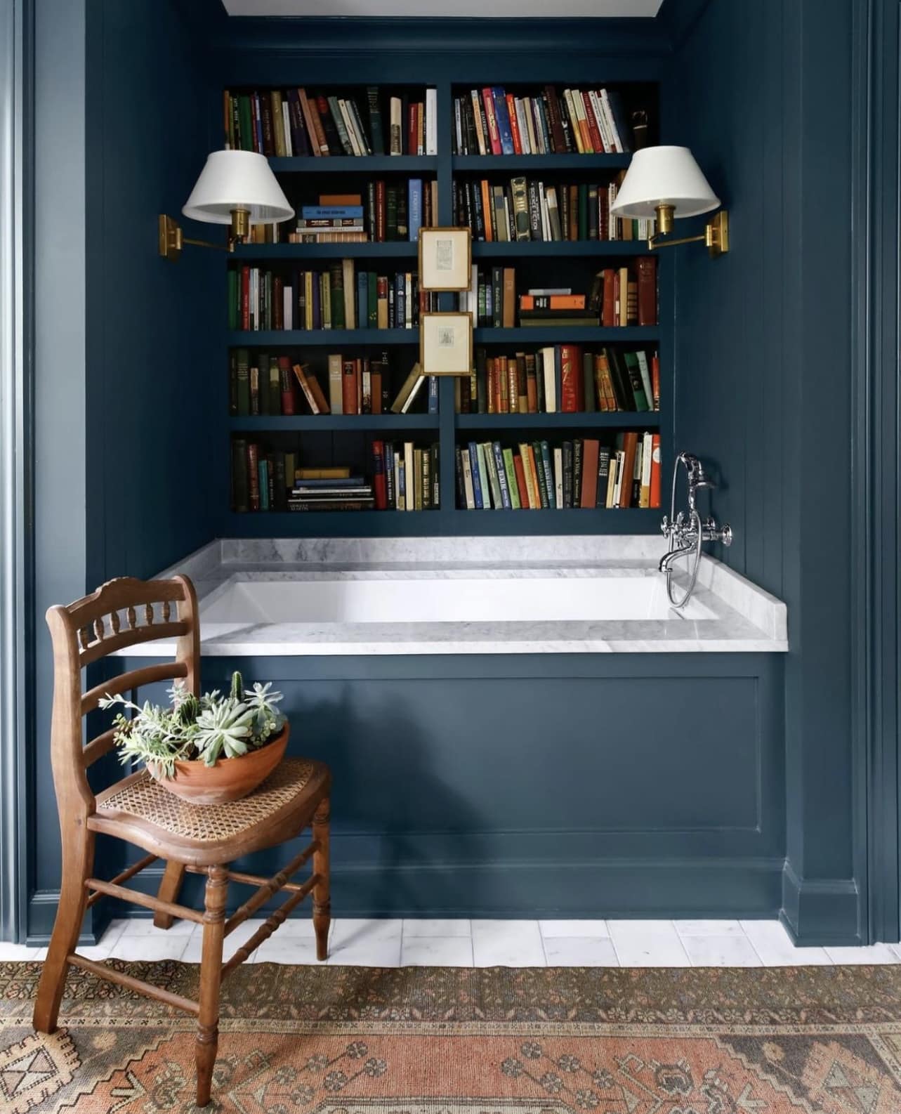 Alt tag for bookcase-blue-bathtub-feature-image-sabarinainteriors-cococozy-blog