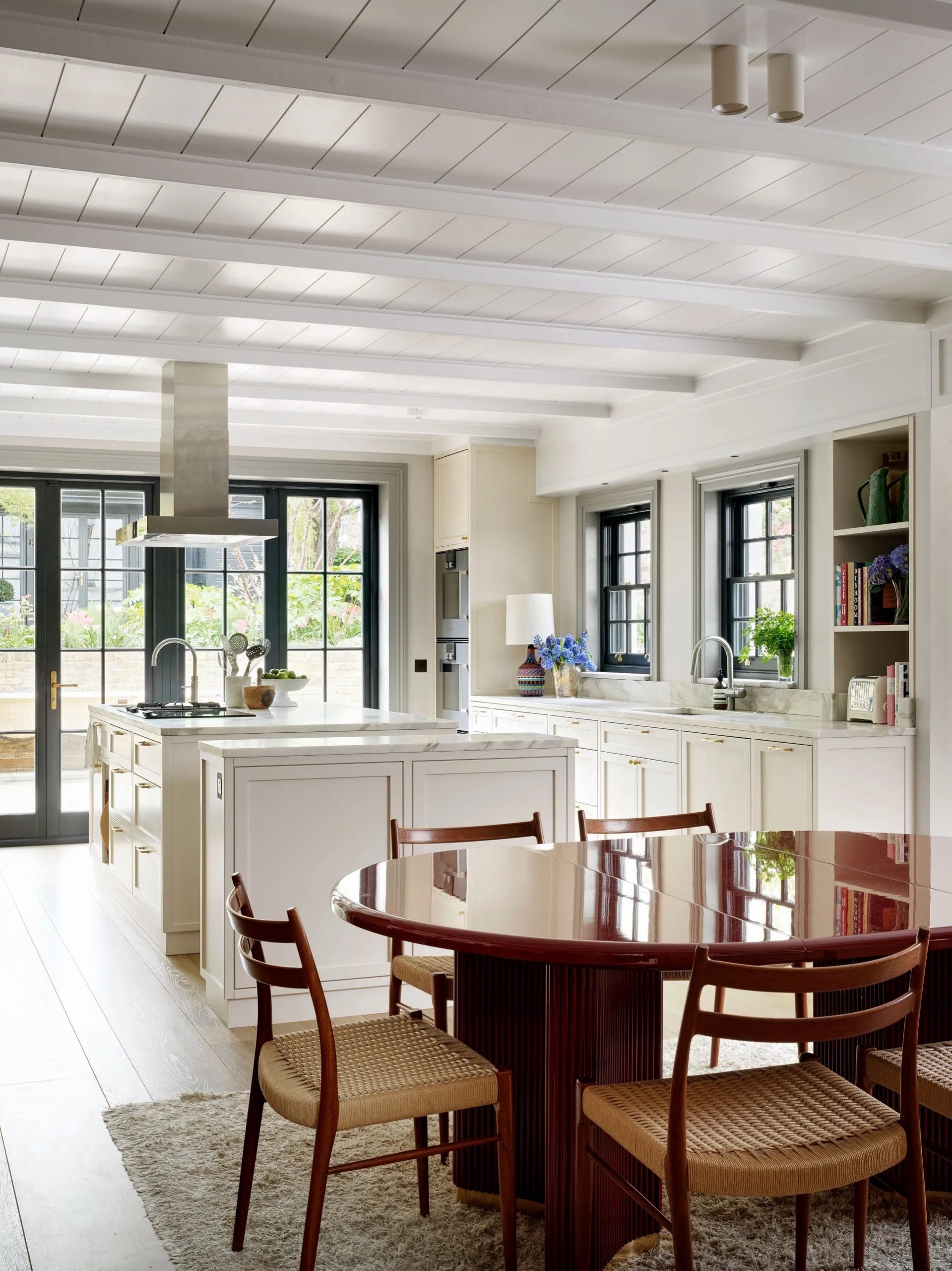 Alt tag for white-kitchen-bareware-serveware-natural-lighting-floor-to-ceiling-windows-cococozy