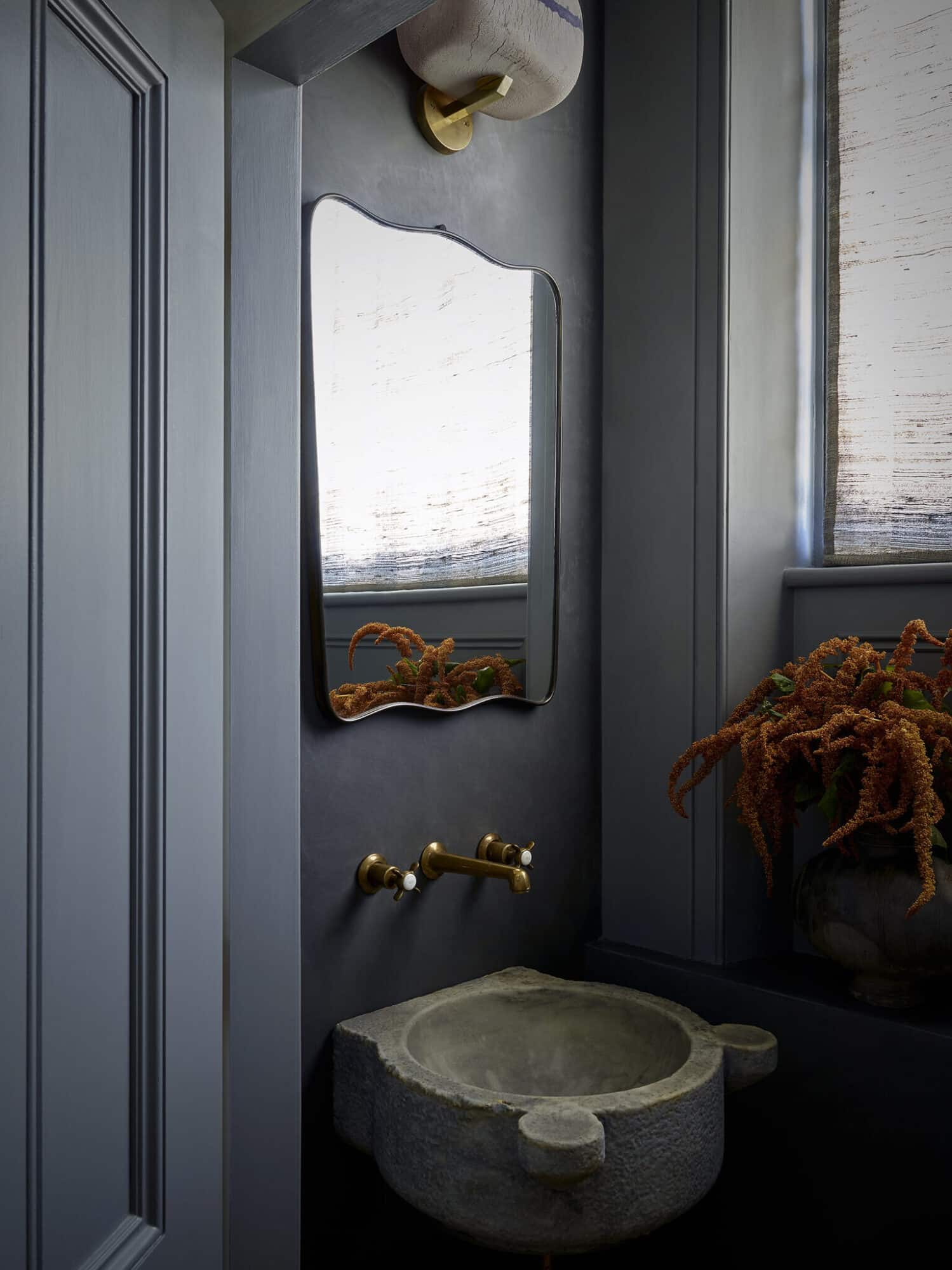 blue-gray-powder-room-stone-sink-asymetrical-mirror-cococozy