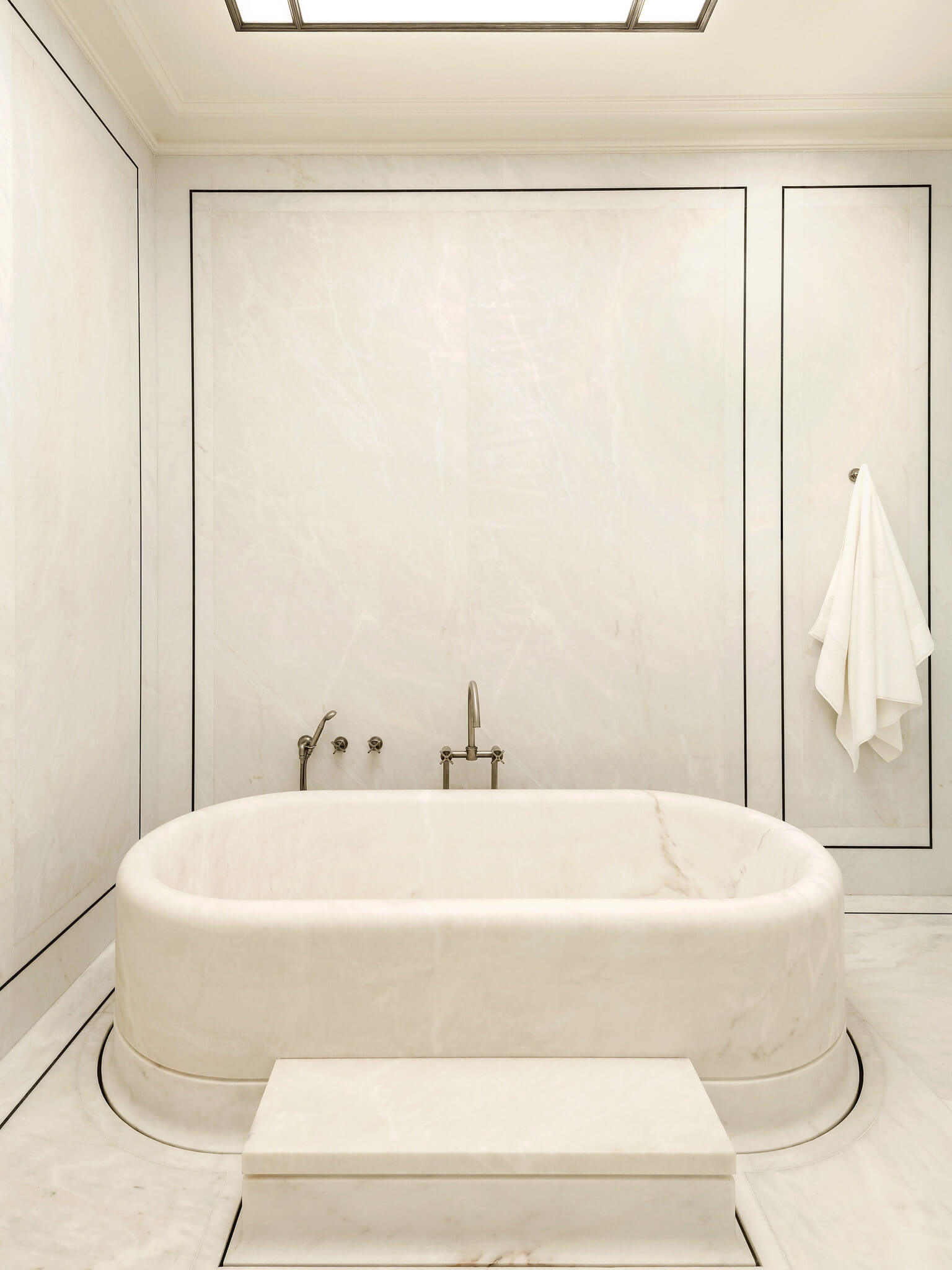 white marble primary bathroom