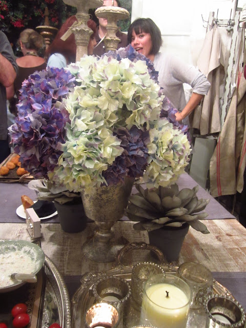 hydrangea flower arrangement on a wood table at the pom pom university party