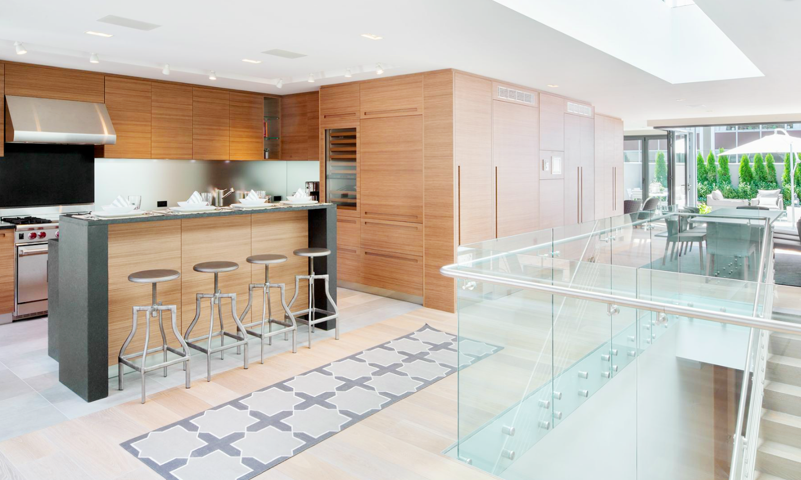 Modern kitchen with sleek wood cabinets in a New York City penthouse