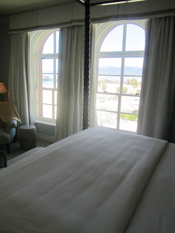 canopy bed in Casa del Mar with a view out of Santa Monica beach