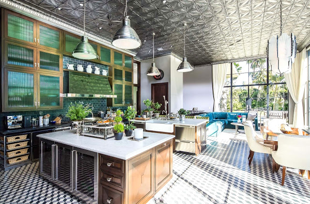 Gourmet kitchen cement tile floor, large silver pendant lights, breakfast nook pressed tin ceiling