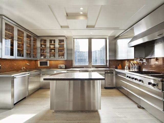 State of the art chef's kitchen with sleek stainless steel cabinets