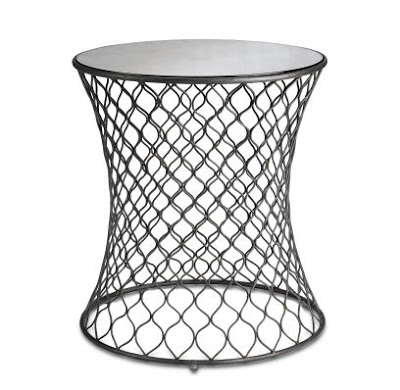 Accent table with wire base bent into curves