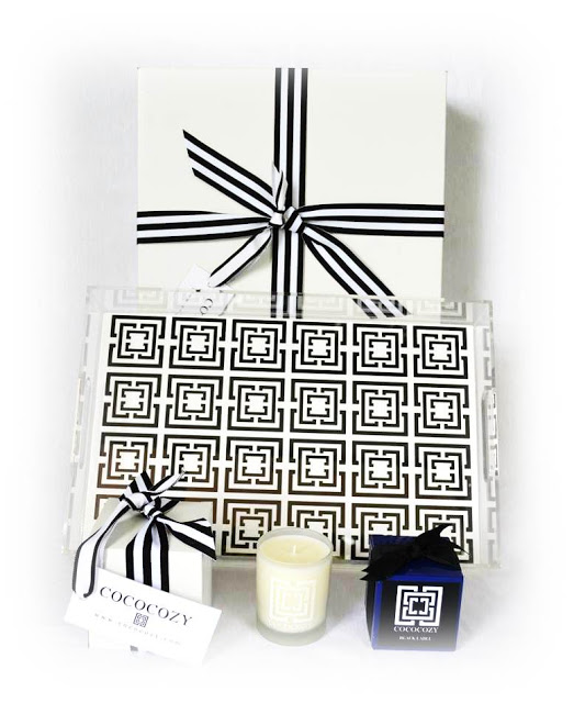 COCOCOZY wrapped box, COCOCOZY Lucite Logo Tray in black and white, COCOCOZY Candles in Black Label and Beach