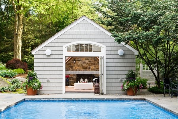 Exterior of a pool house and the pool