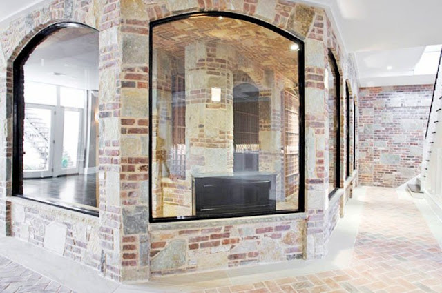 wine cellar with brick walls and brick herringbone floor