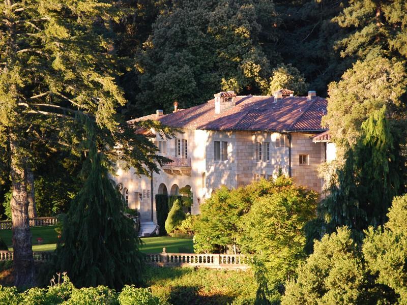 exterior of a Florentine style villa just outside San Francisco, CA surrounded by trees