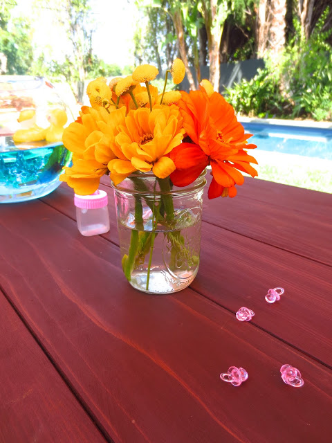 Floral centerpiece at an outdoor baby shower
