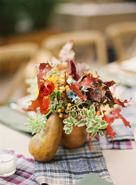 Fall center piece starring seasonal plants and a gourd
