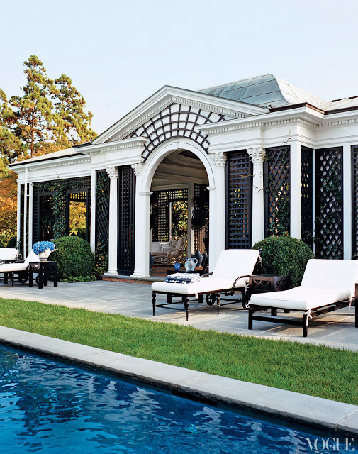 exterior of a pool house with trellis detailing