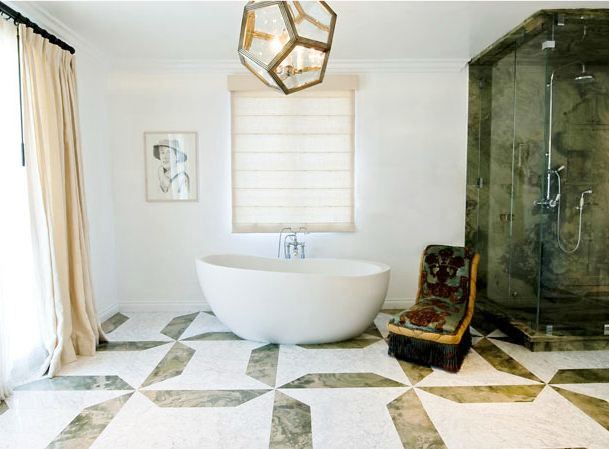 bathroom with stand alone tub, a large window with floor length curtains, tile floor and a dodecahedron light