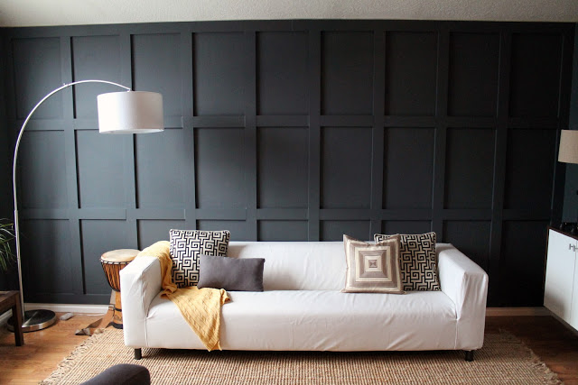 Chris Loves Julia DIY black paneled wall living room