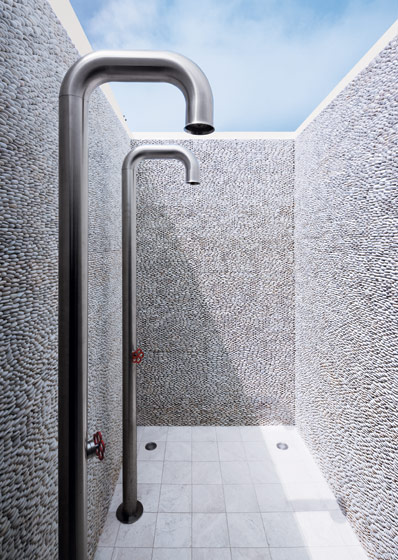 Pebble wall shower in the master bathroom