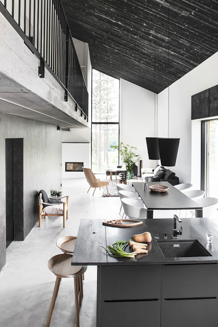 Modern neutral kitchen dining and living room grey black white tan concrete floor