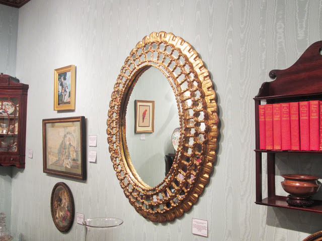 Antique round Peruvian gilt wood mirror